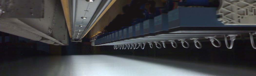 Actual DDS sensors installed across a material inspection line, from the General Vision sales sheet